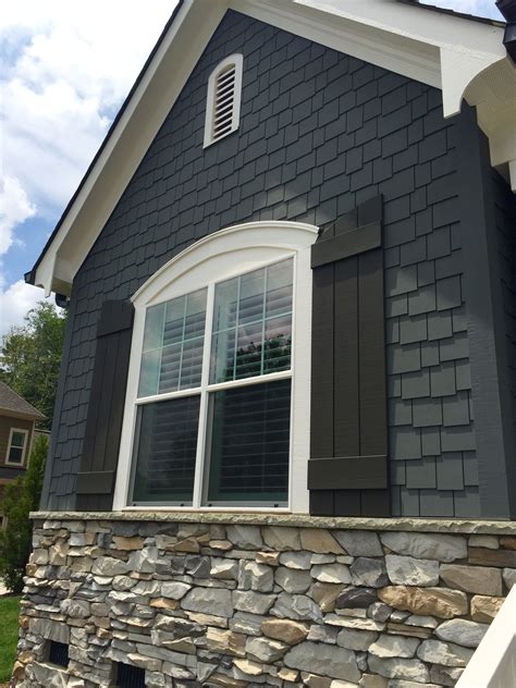 white metal roof grey house|grey houses with black shutters.